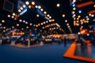 Warm bokeh lights at an event venue, representing DecisionCAMP 2025 conference ambiance