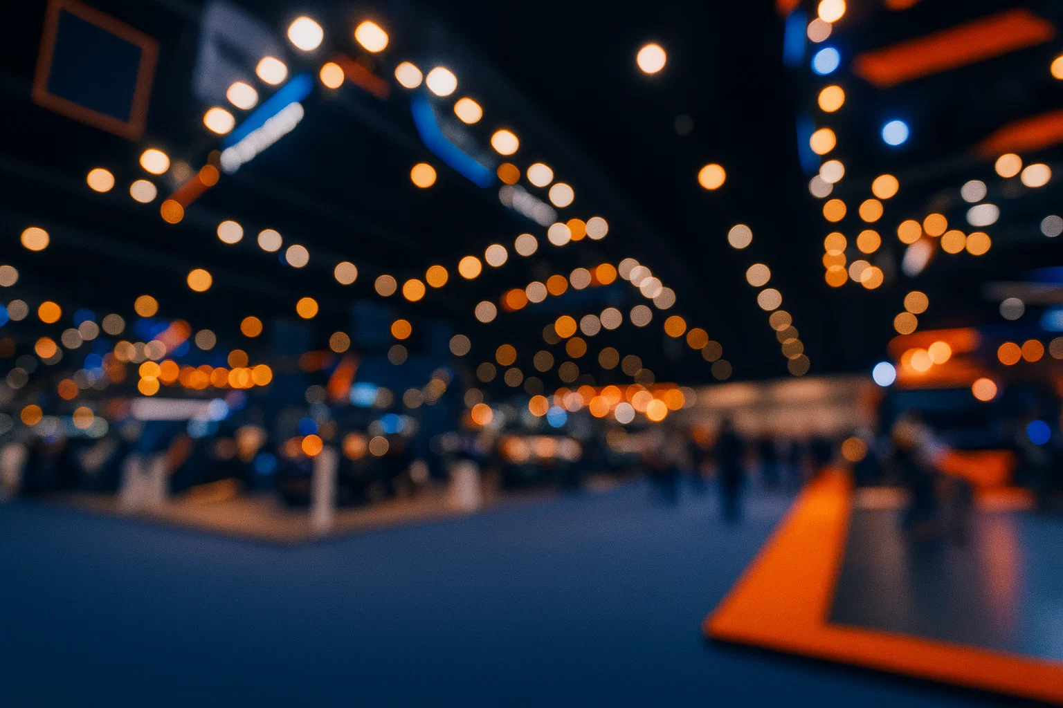 Warm bokeh lights at an event venue, representing DecisionCAMP 2025 conference ambiance